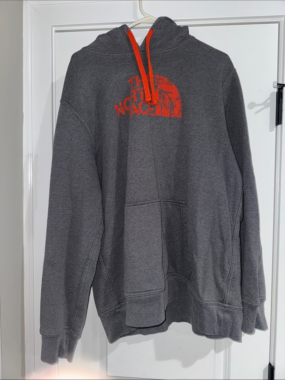 The North Face Charcoal Hoodie with Orange Logo and Drawstrings